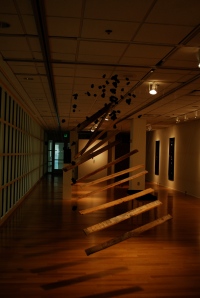Laura Hughes, Thaw, 2009, wood, enamel, pinecones, monofilament. Photo courtesy of The Stamp Student Union Gallery.